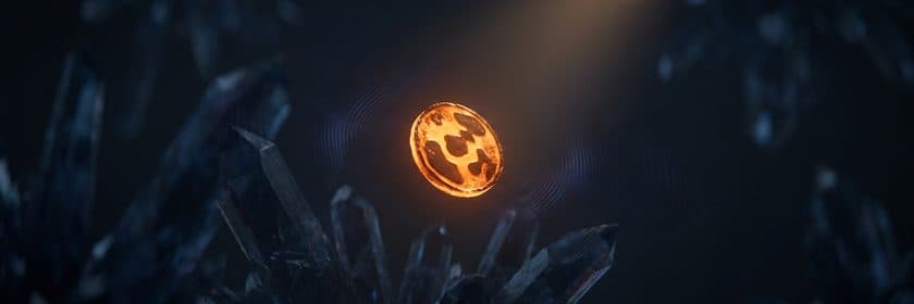 Una moneda dorada brillando entre cristales oscuros